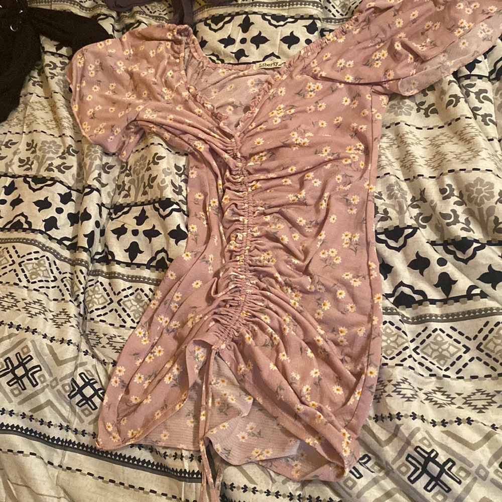 Pretty tight and dress really can fit any size purple with white flowers